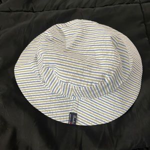 Big boys, bucket hat w/ stripes from Brooks Brothers.